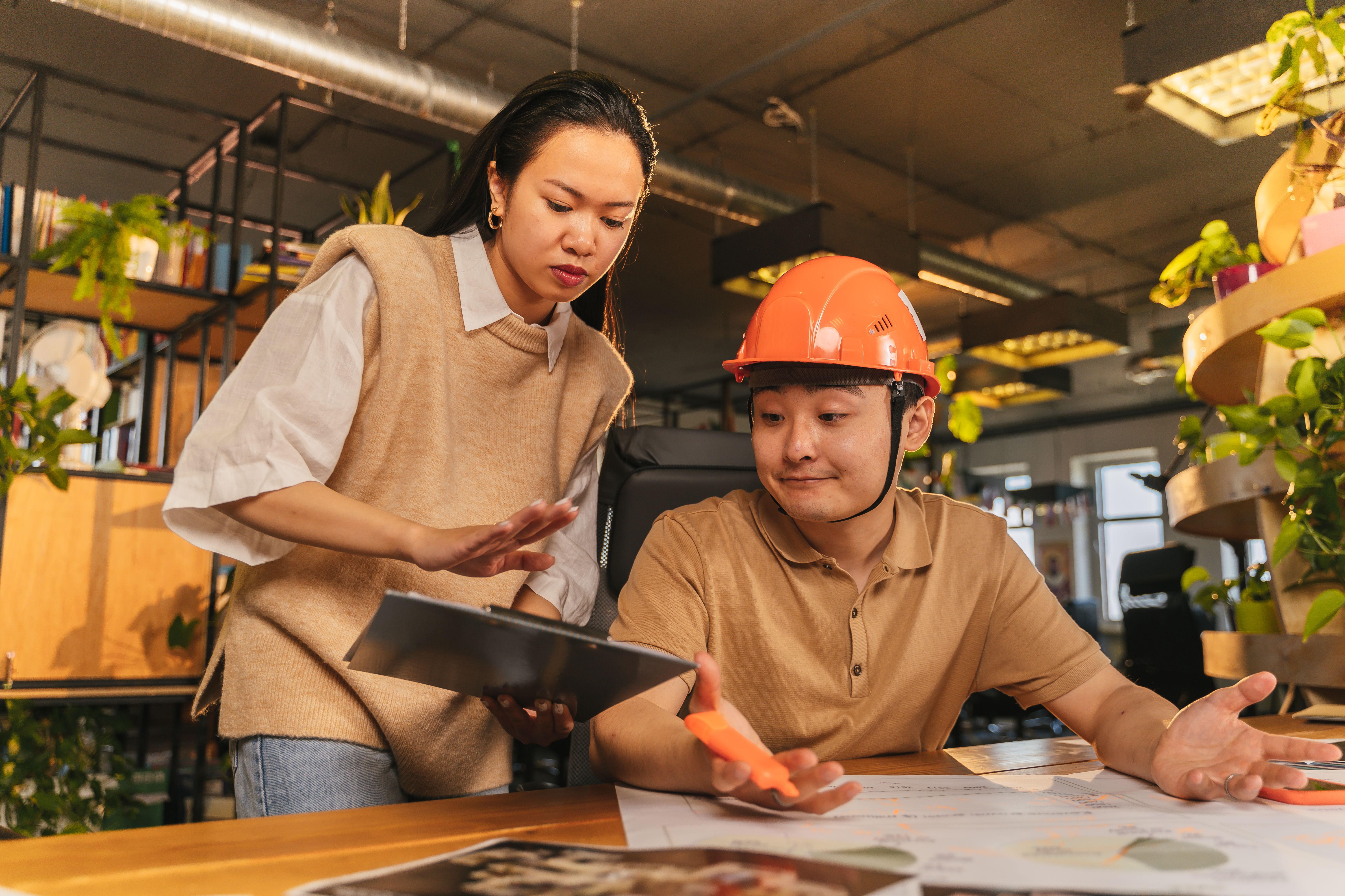 Asian professionals discussing project plans
